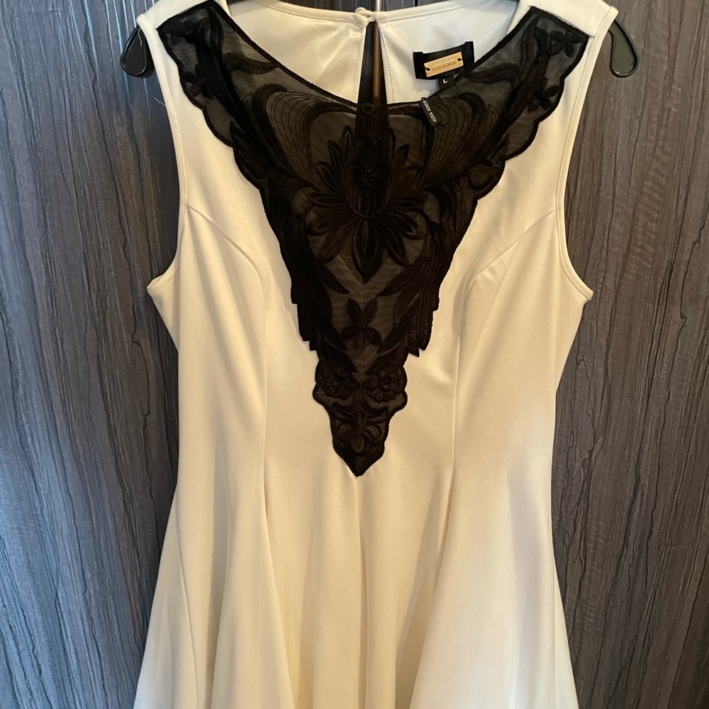 White above knee dress, sheer cleavage design , a line very flattering